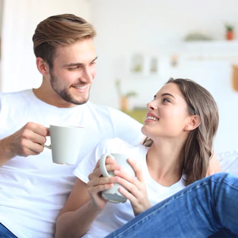 Couple sitting together having an open and relaxed conversation about intimacy