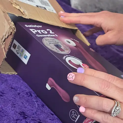 Unboxing the Satisfyer Pro 2 Generation 3 with Lovedo nails on purple throw
