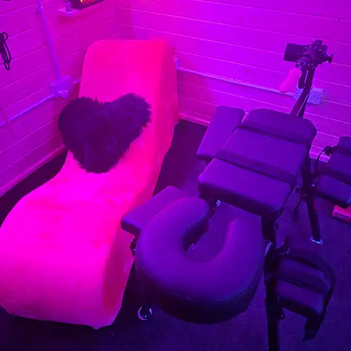Tantra sex sofa, obedience bench and mounted sex machine in custom log cabin