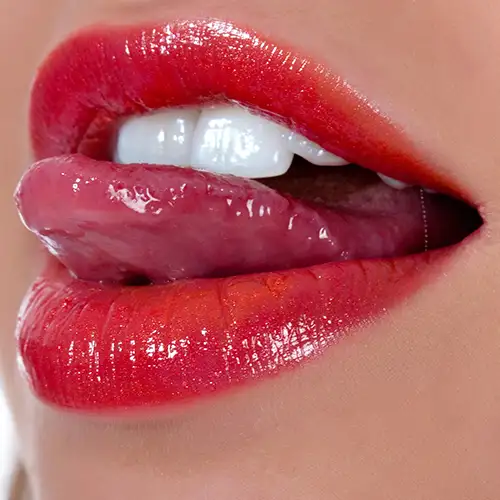 Close-up of lips and tongue, teasing oral play